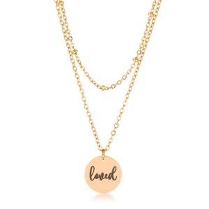 Layered yellow-toned chain necklace with round disc pendant engraved loved
